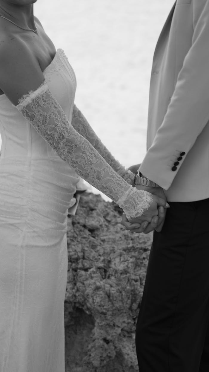 elegant-beach-wedding-bride-and-groom-holding-hands-34274522